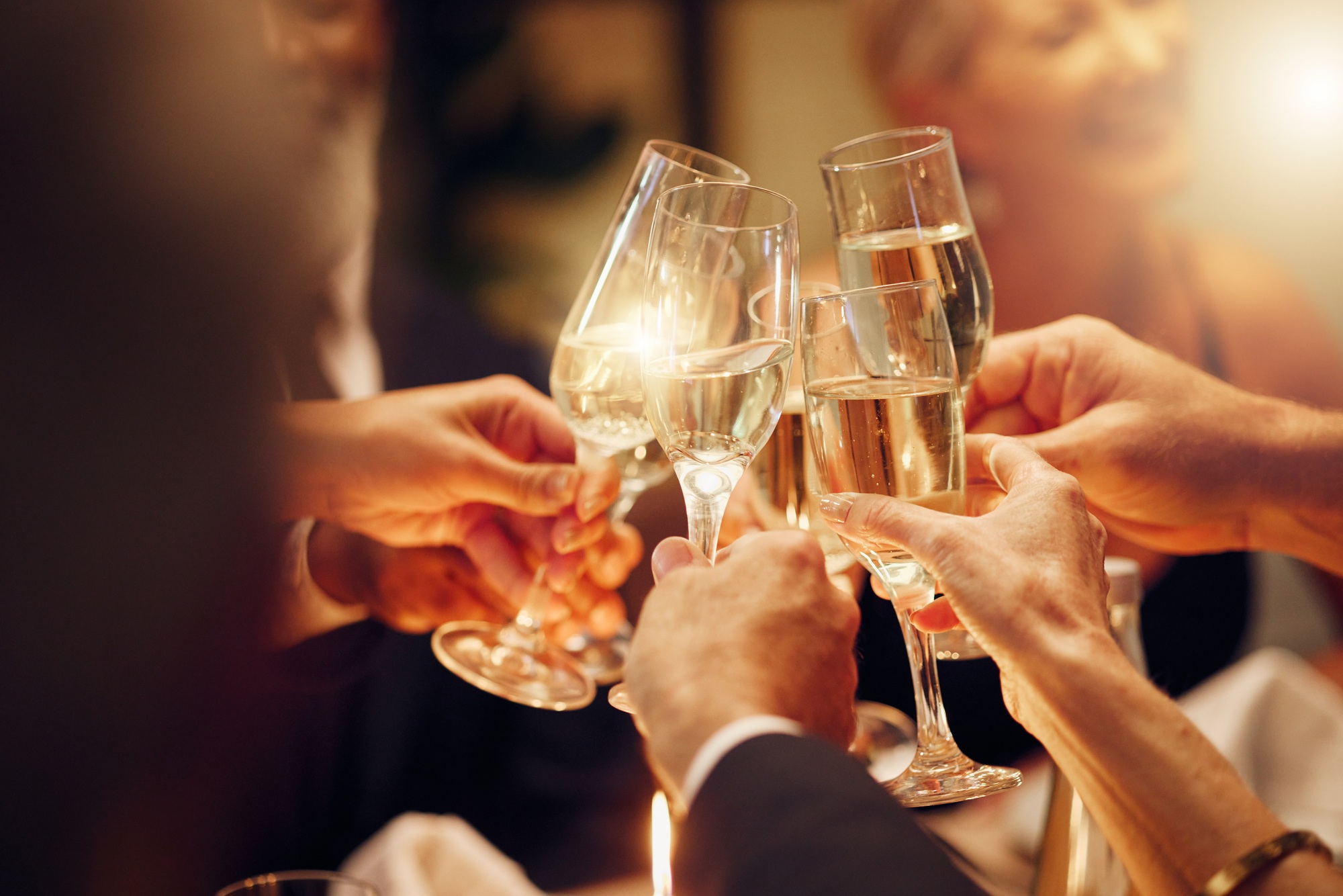 Success, hands or toast in a party for goals, winning deal or new year at luxury social event celeb